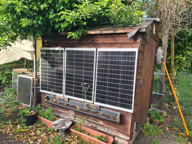 3 panels attached to the side of a shed